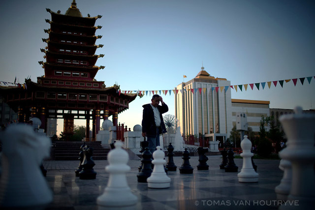 Men play chess open air chess